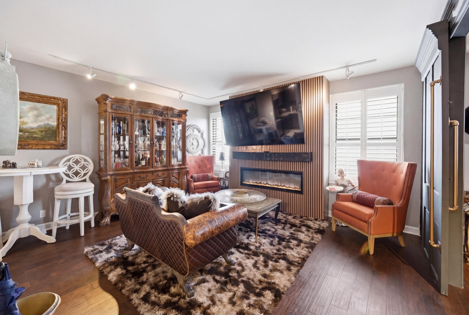 Living room with electric fireplace and slatted accent wall